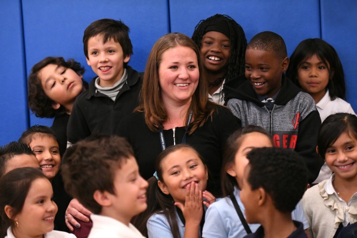 Jennie Schmaltz surrounded by students