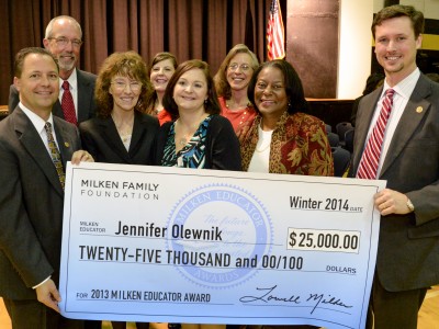 Jennifer Olewnik with VIPs and check