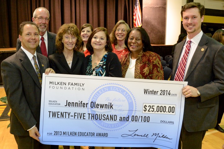 Jennifer Olewnik with VIPs and check