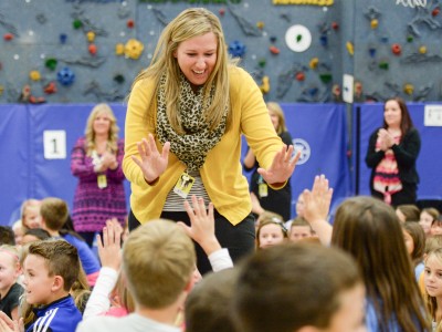 Jessica Karll gets high fives from students