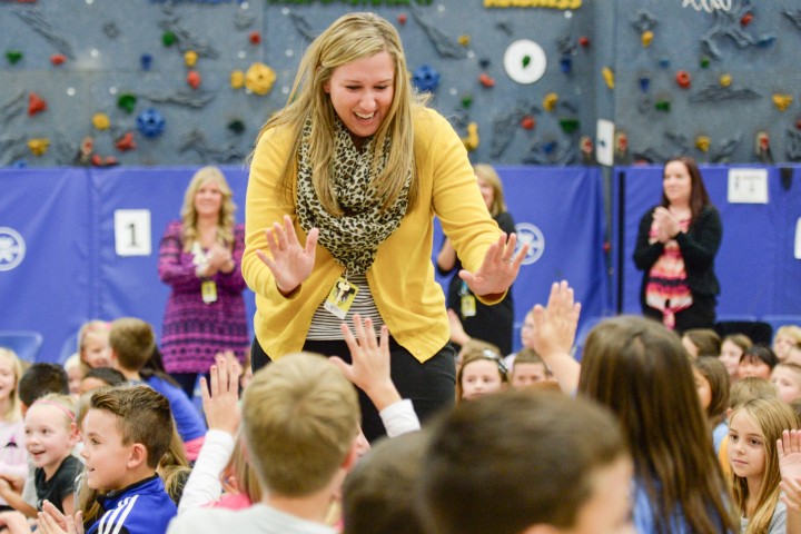 Jessica Karll gets high fives from students