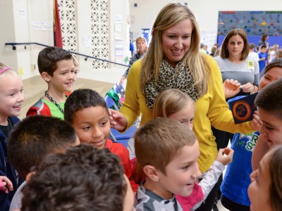 Jessica Karll surrounded by her students