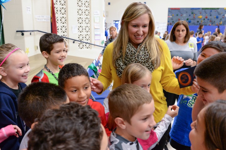 Jessica Karll surrounded by her students