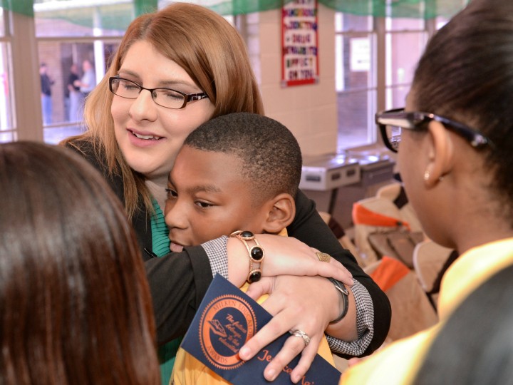 Jessica Major hugs Port Allen student