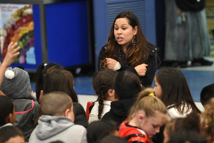 Jessica Villanueva with students before assembly