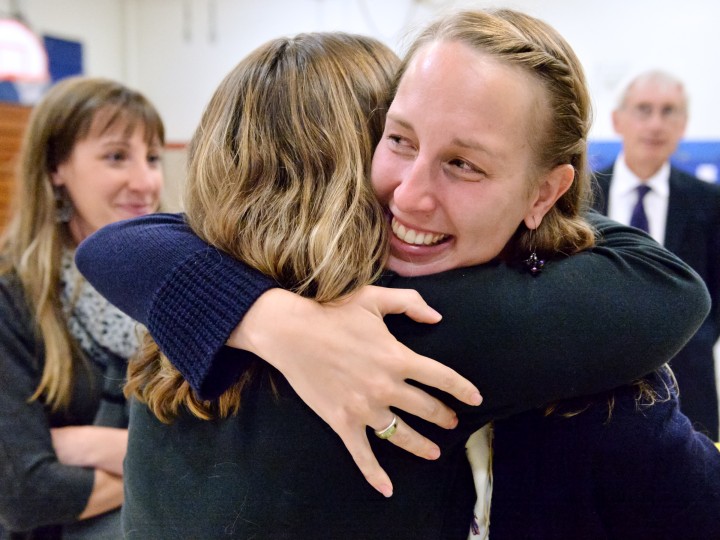 Josie Igielski hugs colleague