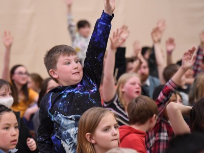 Journey students hands up