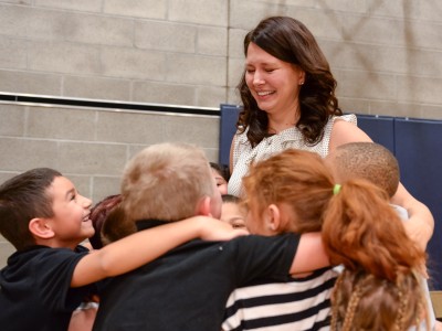 Julie Cleave hugged by students