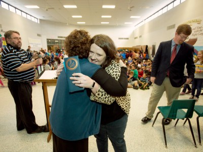 Kara Davis hugs principal at end