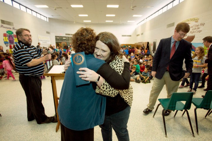 Kara Davis hugs principal at end