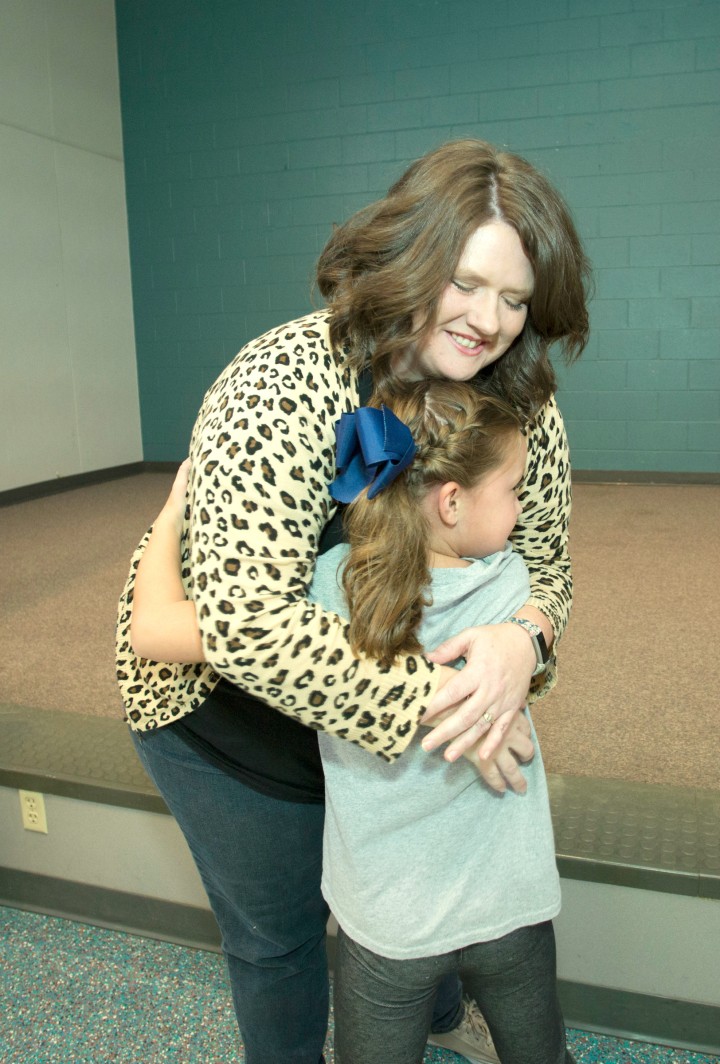 Kara Davis hugs student