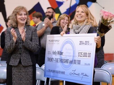 Kelly Wilber applauded with check