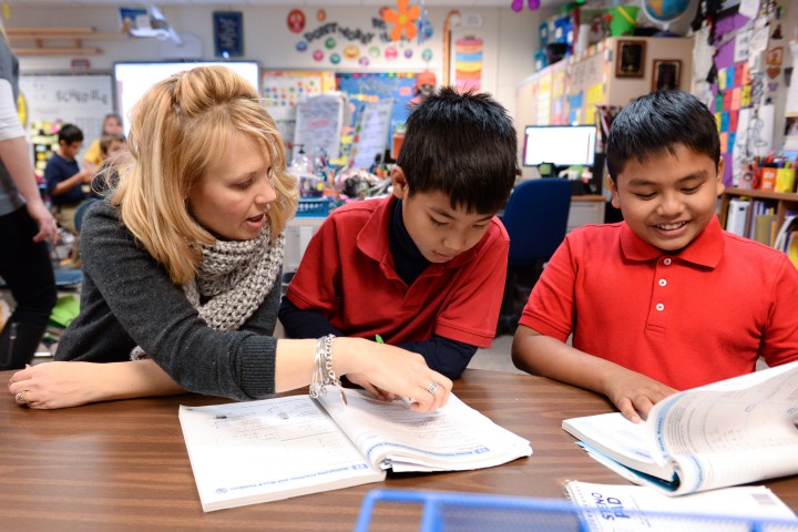 Kelly Wilber in classroom with students