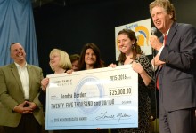 Kendra Borden holds check with veteran Milken Educators