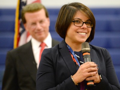 Kimberly Moreno addresses students as Lowell Milken looks on