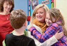 Krystle Bryant gets hugs from students