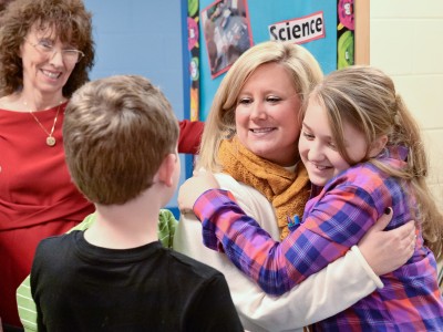 Krystle Bryant gets hugs from students