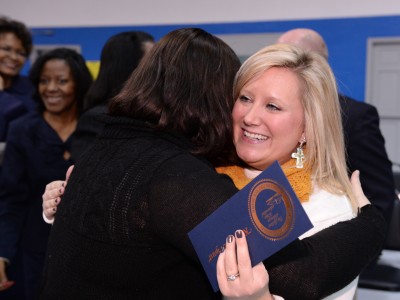 Krystle Bryant hugged by colleague
