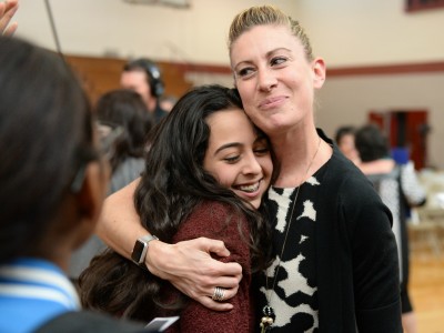 Lauren Jensen hugs student