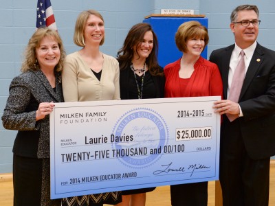 Laurie Davies and VIPs with check