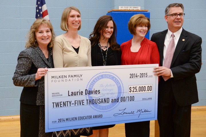 Laurie Davies and VIPs with check