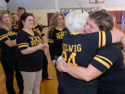 Lindsay Frevert hugs from colleagues
