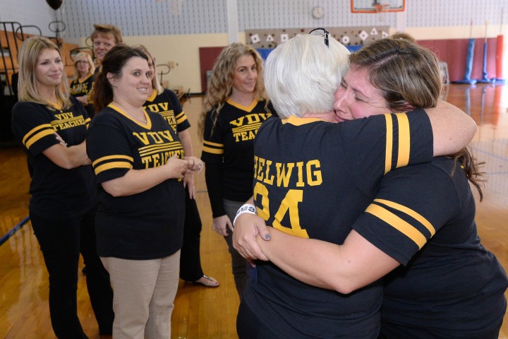 Lindsay Frevert hugs from colleagues
