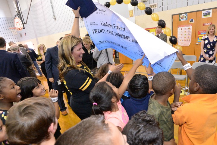 Lindsay Frevert shows students check