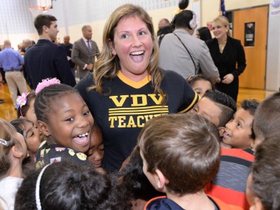 Lindsay Frevert surrounded by students