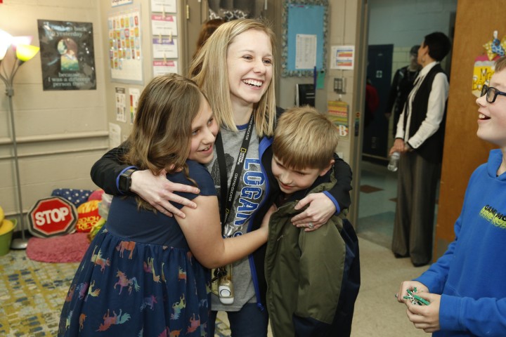 Logan Kristine Becker students hug