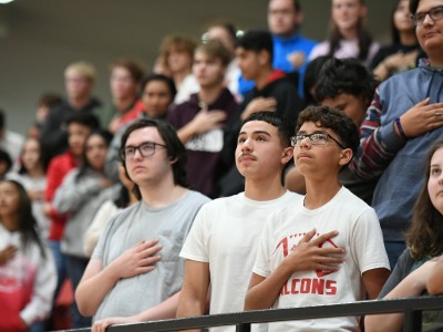 Loving students hands over hearts