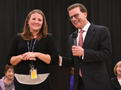 Lowell Milken congratulates Jennie Schmaltz