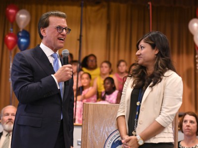 Lowell Milken congratulates Katherine Shaw