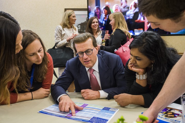 Lowell Milken helps Milken Educators choose panels MEA Forum 0324