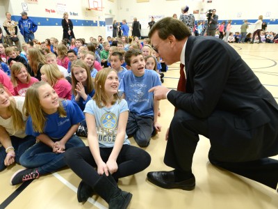 Lowell Milken talks with Rim Rock students before assembly