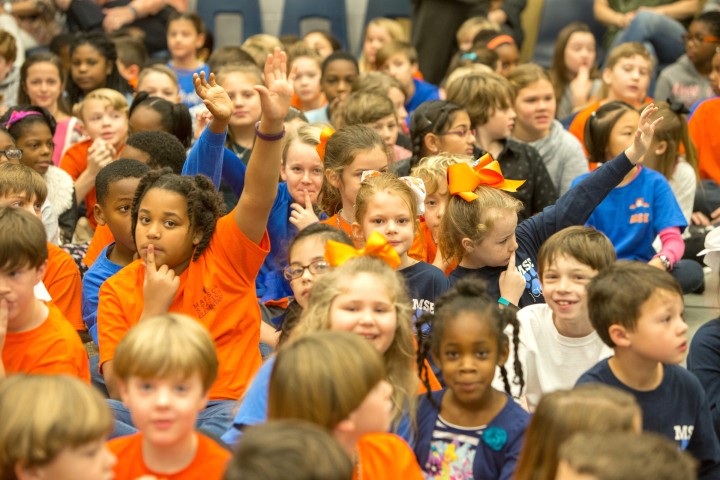 Madison Station students hands up