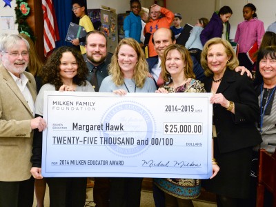 Maggie Hawk Mike Milken group with check