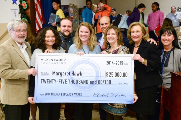 Maggie Hawk Mike Milken group with check