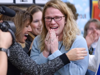 Maggie Hawk congratulated by colleagues