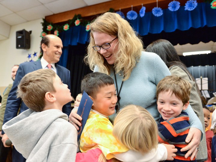 Maggie Hawk hugged by students