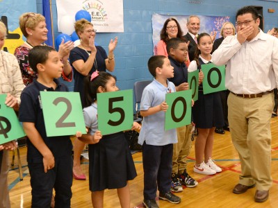 Manny Zaldivar walks to front with students