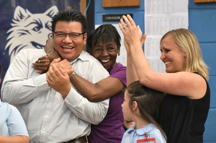 Manny Zaldivar with happy colleagues