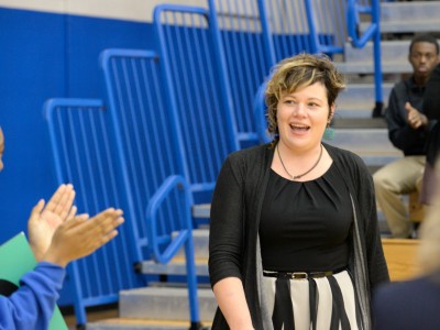 Melody Coryell walks to front of gym