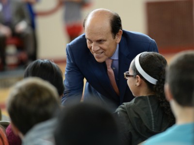 Michael Milken meets kids before assembly