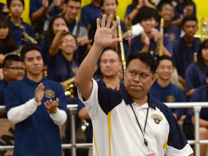 Michael Sana waves to crowd