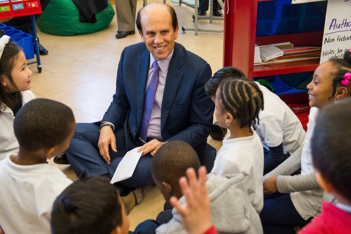 Michelle Johnson Mike Milken gets autographs from students