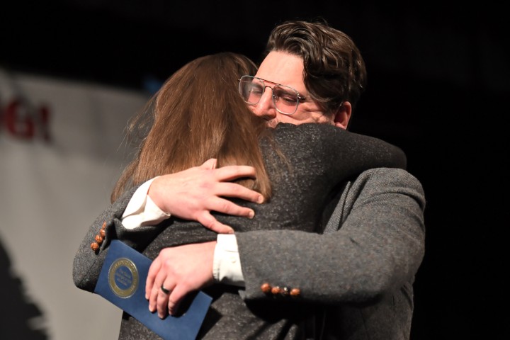 NC Page Justin Scarbro hugs wife