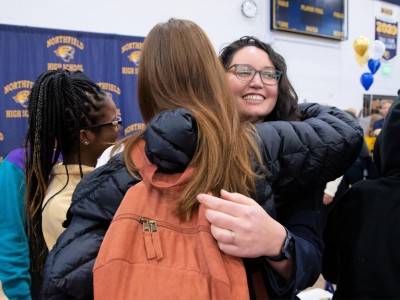 NHS Reina Cruz students hug