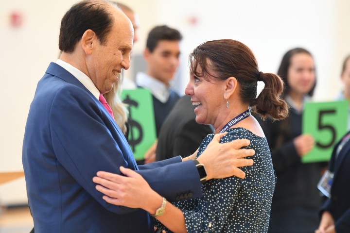 Newark Charter 2017 Mike Milken congratulates Tami Lunsford