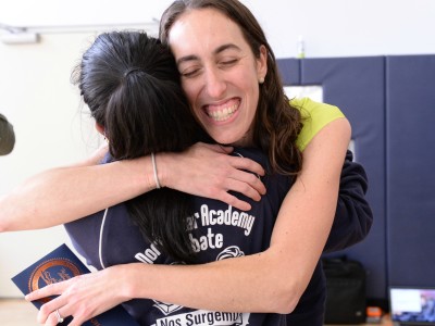 North Star Academy student hugs Allison Cuttler